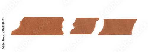 Three pieces of brown adhesive masking tape strips for office and craft work