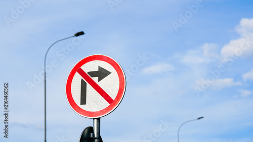 Cuadro en lienzo Traffic prohibition sign showing no left turn against clear sky, representing ro