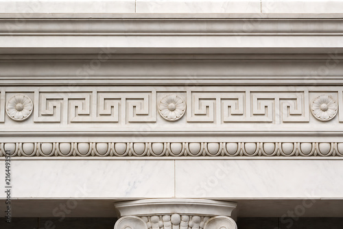 Ancient Greek-inspired marble entablature frieze detail with geometric pattern