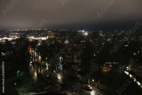 Tallinn cityscape at night, streets and city lights high angle view