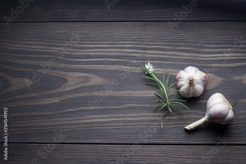 Rosemary and Garlic on wooden table top view