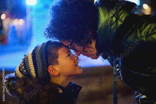 Fotografie Mother and son sharing affectionate moment at night