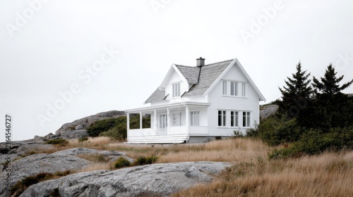 Serene White House on Rocky Terrain Under Overcast Sky