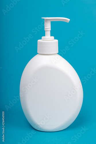 Blank White Plastic Pump Bottle Mockup on Blue Background, Cosmetic Lotion Soap Dispenser Container Product Shot