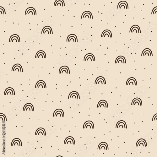Seamless minimal pattern with hand drawn brown rainbows and small scattered dots on a warm beige background. Simple neutral boho design for kids textiles, nursery decor and wrapping paper.