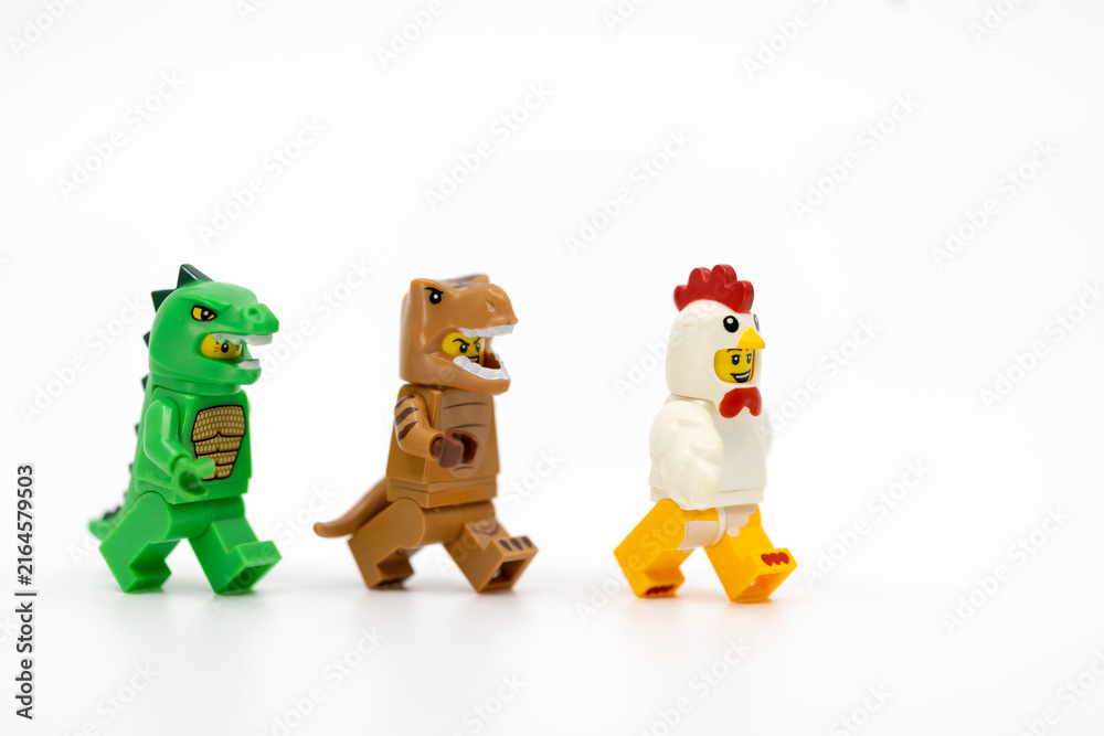 Fototapeta premium Hong Kong, June 8, 2026: Three animal suit minifigures line up in a playful display of the evolutionary link between dinosaurs and birds.