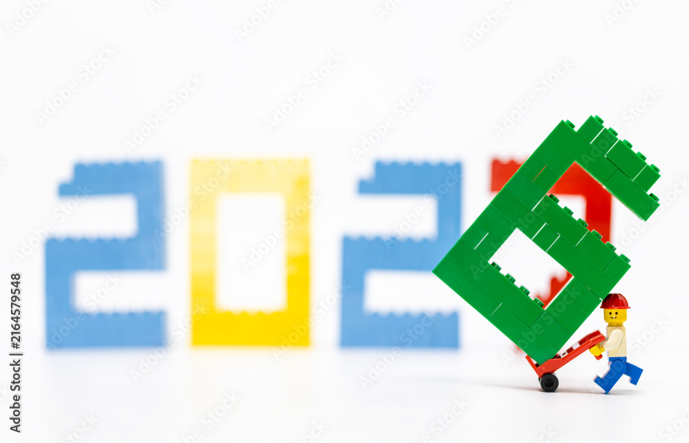 Fototapeta premium Hong Kong, August 20, 2026: A worker carries the final digit seven, symbolizing the start of 2027 and a new era.