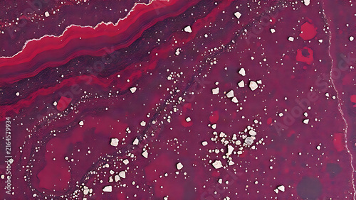 Close-up of polished purple-red porphyry with scattered pale crystalline grains.