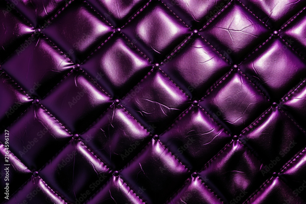 Naklejka premium Purple quilted leather texture with glossy diamond pattern as shiny padded surface in metallic purple with buttoned stitching featuring luxurious purple upholstery texture with glossy tufted diamonds