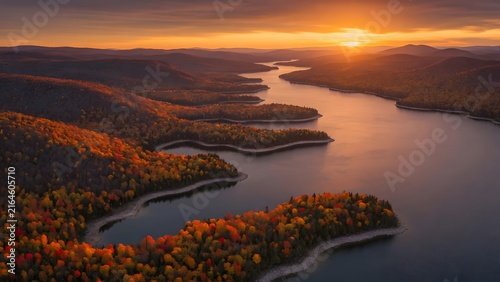 Autumn landscape with brilliant leaves accentuating a chain of overlapping shoreline curves surrounding a sunset lake, Environment: intricate coastline with natural inlets, wooded headlands and broad 