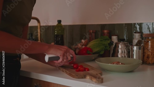 Healthy Cooking: Hands Chopping Fresh Tomatoes In Kitchen