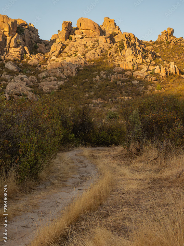 Fototapeta premium Trail meandering into rocky mountain landscape 