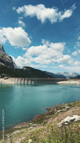 Alpine reservoir and dam in Dolomites, Alps, Italy