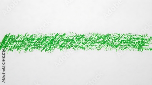 Obraz na plátně Bright green crayon scribble on a white surface creating a textured line with ar