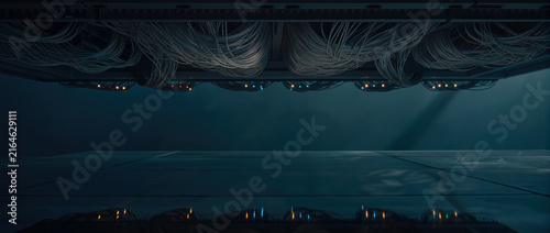 Dark futuristic fiber stream beneath illuminated structure