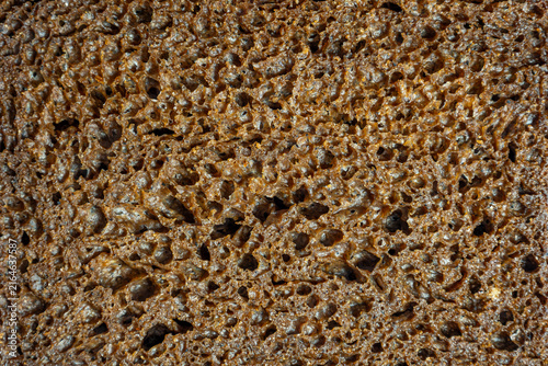 Картината върху платно Close up slice porous rye bread texture detailed structure