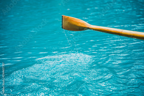 Canvastavla Close-up of a wooden boat paddle over clear turquoise water at Lago di Braies in the Italian Dolomites, capturing an alpine boating and travel experience