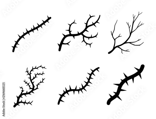 Set of black silhouette featuring various thorny branches, vines, and bare tree twigs on white