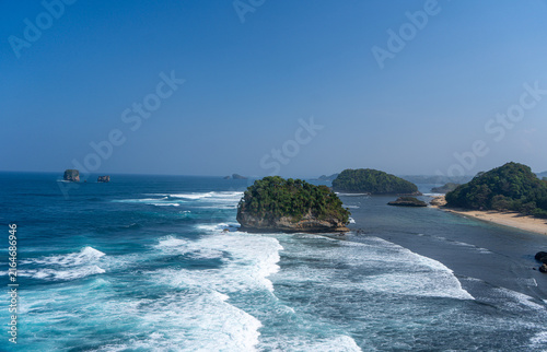 Принти на полотні The vast, blue expanse of the sea viewed from atop the cliffs at Tanjung Penyu, Malang