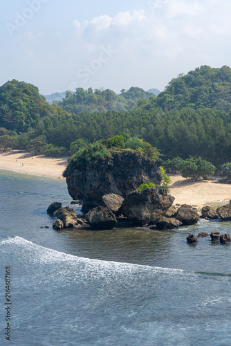 Obraz na płótnie A vast expanse of rocky outcrops viewed from the clifftop at Tanjung Penyu, Malang