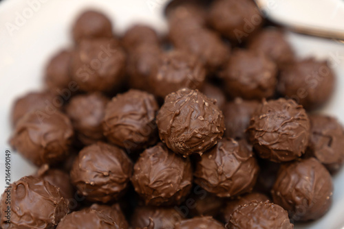 Quadro su tela Mouthwatering close up of dark chocolate truffles, a decadent artisan treat