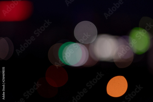 Canvastavla Abstract colorful bokeh lights against dark blurred night background