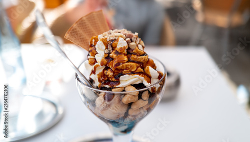 Caramel nut ice cream sundae in a glass