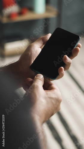 Close up of hand plugging and unplugging USB C cable into smartphone vertical video