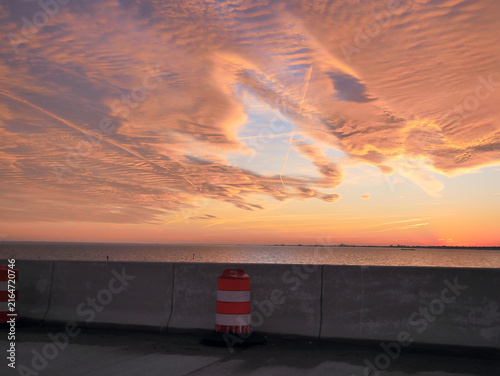 фотографія Orange and red sunset sky with glowing clouds, dramatic evening atmosphere and colorful cloudscape background