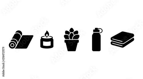 Fitness and relaxation essentials: yoga mat, candle, succulent, water bottle, towels