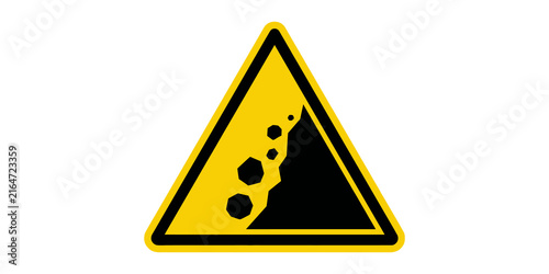 Obraz na plátne Warning sign with falling rocks, black boulders tumbling down a yellow triangle with a bold black border