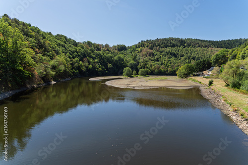 Low water level and exposed shoreline during summer drought in Germany