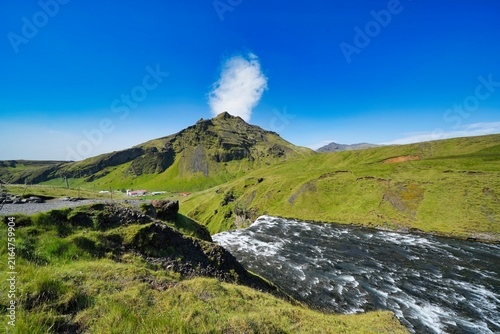 Photography Skogafoss is a waterfall on the Skoga River in the south of Iceland at the cliff marking the former coastline