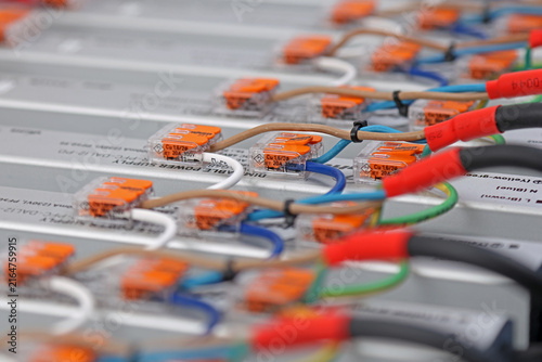 Connect electrical modules using electrical insulated wiring wires in the electrical control panel. 