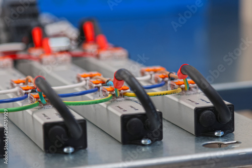 Connect electrical modules using electrical insulated wiring wires in the electrical control panel. 