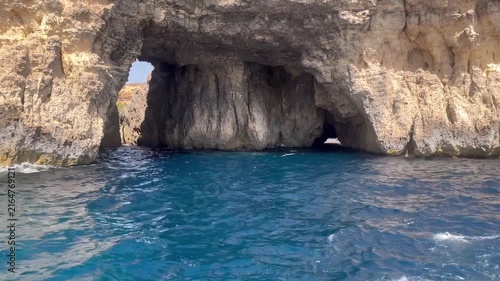 Boat trip past sea caves and rugged limestone cliffs, Malta, Mediterranean Sea