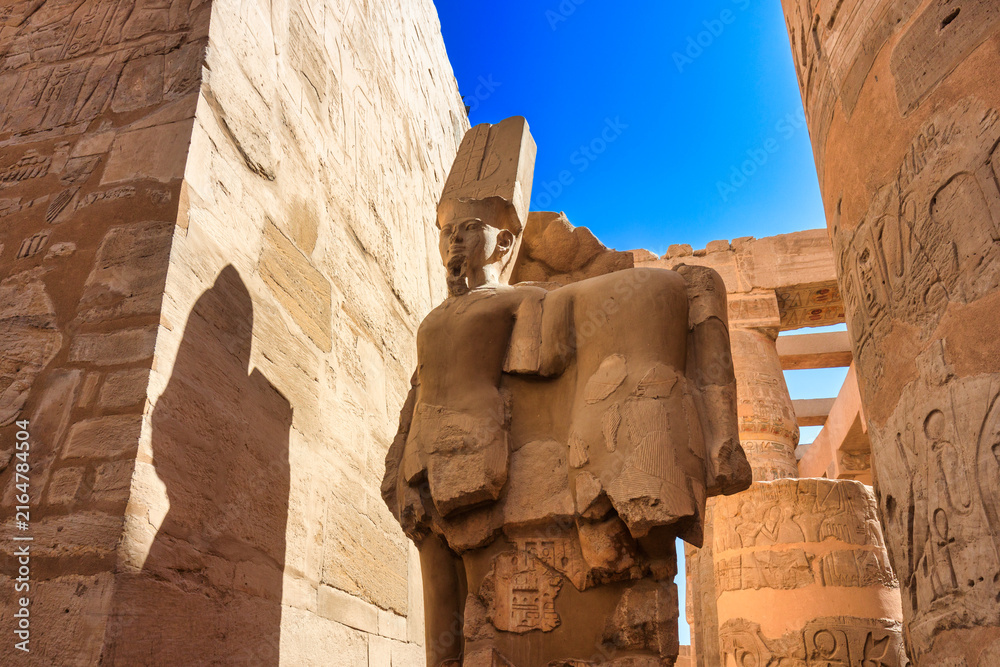 Fototapeta premium Karnak Temple Complex in Luxor – Ancient Egyptian Columns, Hieroglyphs and historic landmark, Egypt