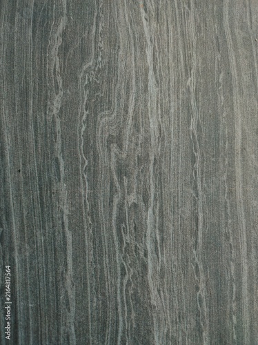 Foto Gray textured surface with vertical striations