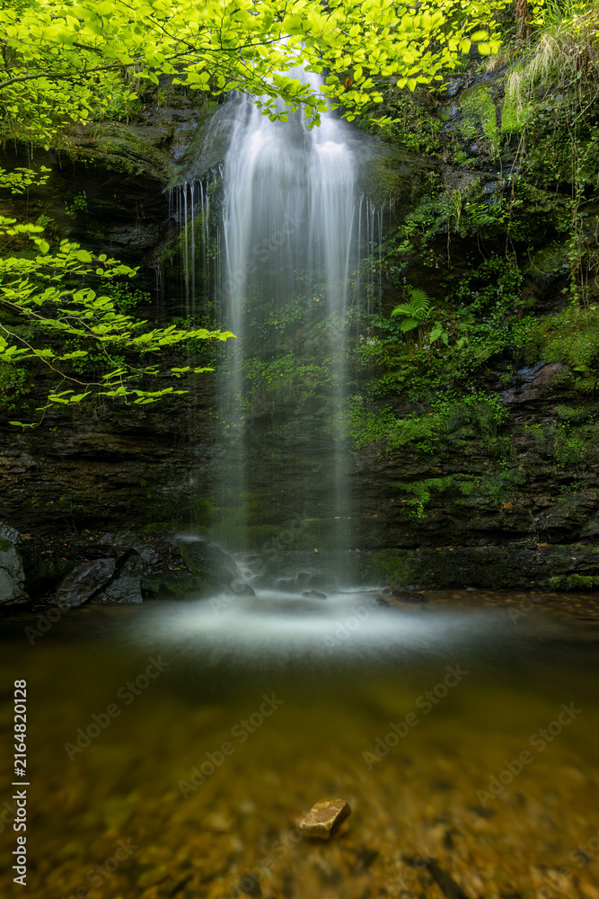 Obraz premium Lamiña Waterfalls, also Known as Úrsula Waterfalls, in Saja-Besaya Natural Park, Cantabria, Spain