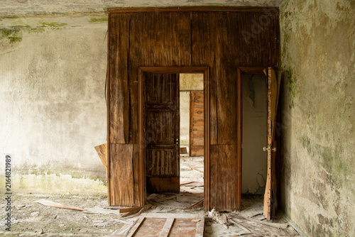 Canvas Print Abandoned old building without renovation, with traces of dampness and mold and