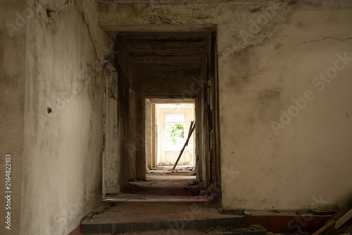 Canvas Print An abandoned old building without renovation and with signs of dampness and mold