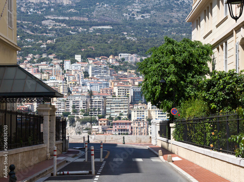 фотографія Empty Monaco street, framed view of dense hillside cityscape