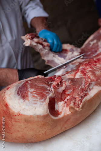 Working on a block in a butchery shop