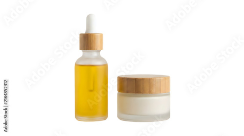 Frosted glass cosmetic dropper bottle with yellow oil and a matching cream jar with bamboo lids isolated on transparent background