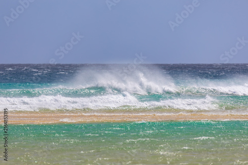 Panoramic view of the turbulent turquoise waves of the Atlantic Ocean – Canary Islands, Fuerteventura; background or wallpaper for your project