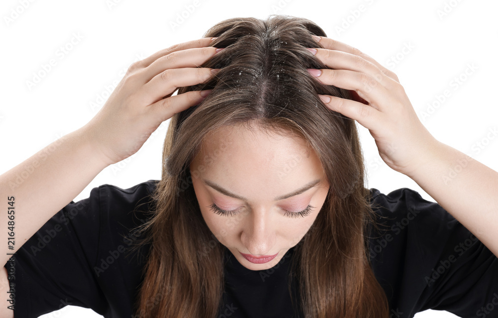Fototapeta premium Dandruff problem. Woman examining her head on white background, above view