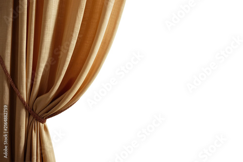 Golden curtain tied back with elegant flowing fabric folds