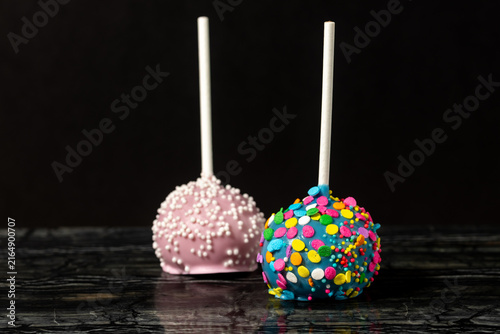 Close-Up of Colorful Cake Pops on a Dark Background
