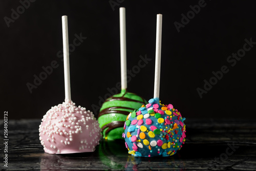 Close-Up of Colorful Cake Pops on a Dark Background