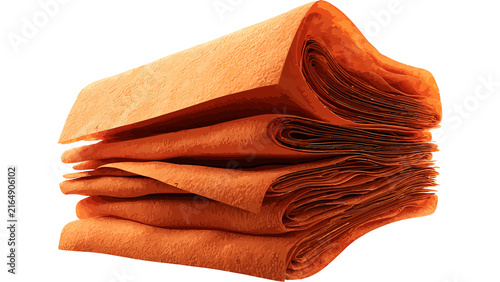 Stack of folded orange leather material isolated on white